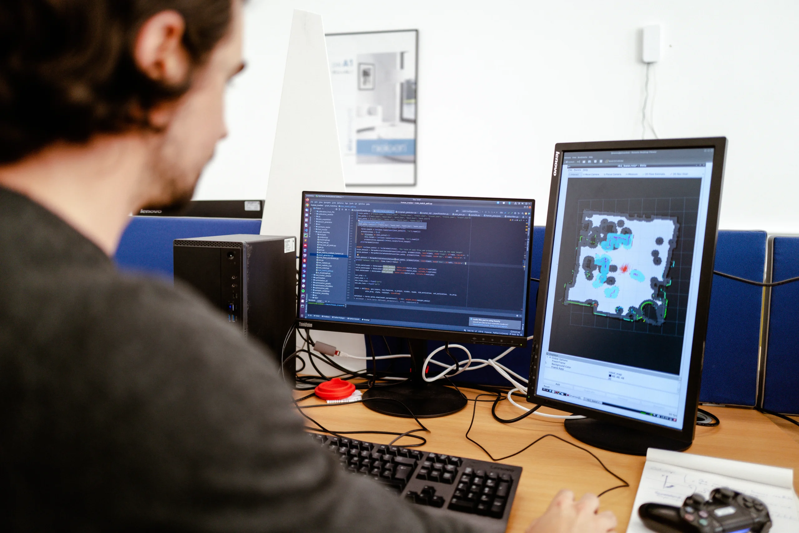 Is a master’s degree in computer science worth it in 2026 - man working on coding on two screens at desk