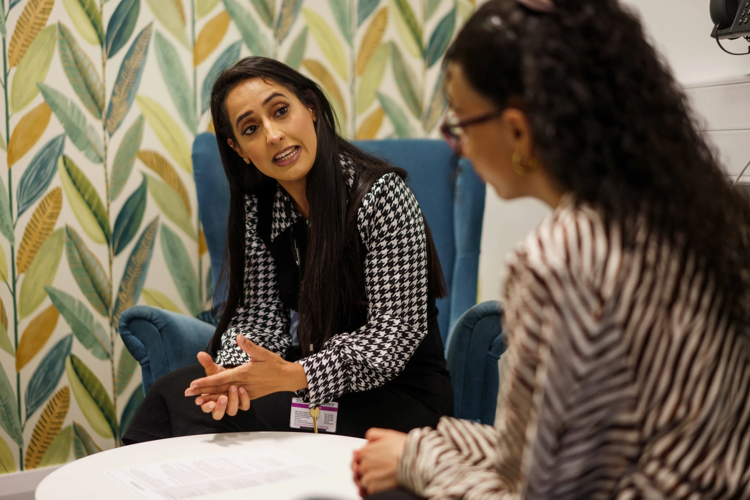 Why studying psychology can strengthen your HR career - a student engaging with a lecturer around a coffee table